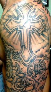 Designed like a piece of pretty jewelry, this cross tattoo on foot looks graceful. Stone Cross With Roses Clouds And Rays Pittsburgh Tattoo Studio Tattoos Mens Shoulder Tattoo Sleeve Tattoos