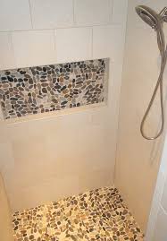 Porcelain Tile Cream Shower Walls With Accent Pebble Niche And Shower Floor Pebble Shower Floor Shower Wall Tile Shower Wall