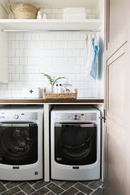 Laundry Room With Subway Tile Cobblestone Herringbone Floors And Butcher Block Counter Top Stylish Laundry Room Laundry Room Design Laundry Room Inspiration