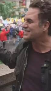 Mark Ruffalo speaks to a reporter at New York's HUGE No Kings protest
