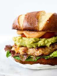 Add toppings like slaw and sauce, plus your chosen side dishes, then dig in. Bacon Cheddar Chicken Burgers With Guacamole Foodiecrush