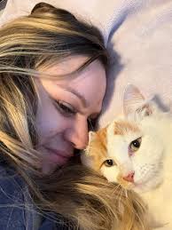 UPDATE: She managed to escape my backyard and left, hopefully to go home.  Found cat in my backyard. No microchip or tag