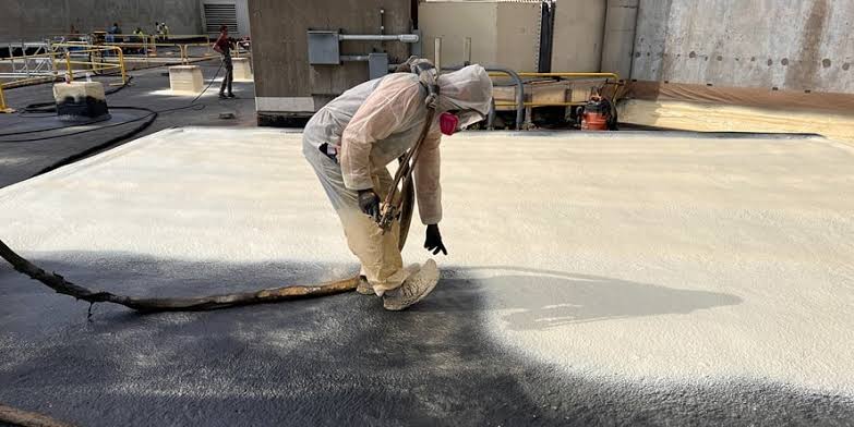 Spray application of expanding roof coating system, AI generated