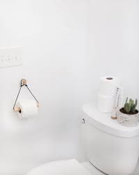 The delta trinsic wall mounted toilet paper holder is a stunning addition to the interiors of your bathroom. The Toilet Paper Holder An Unexpected Source Of Beauty In The Bathroom