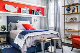 You even can make furniture pull double duty, such as using a dresser next to your bed for clothes storage and to serve as your nightstand. Orange And Blue Boy Room With Long Shelf Over Bed Transitional Boy S Room