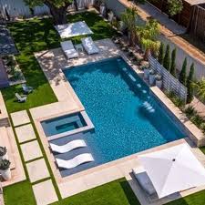 A lap pool is a type of swimming pool where it is said to be a large enough for one person only to swim laps. Swimming Pool Design With Hot Tub And Waterfall Feature In 2020 Pools Backyard Inground Backyard Pool Designs Backyard Pool Landscaping