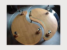 The design is engraved then filled with metallic grey epoxy. Wood And Glass Yin Yang Coffee Table Apartment Therapy S Bazaar