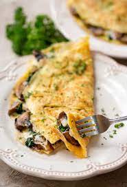 10 Simple Omelet Recipes For Quick Easy Meals Parade Spinach Omelet Omlet Recipes Stuffed Mushrooms