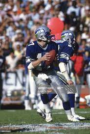 Dave Krieg Of The Seattle Seahawks Drops Back To Pass Against The Nfl Football Helmets Seahawks Seattle Seahawks