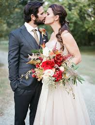 Combined vibrant blooms (like ranunculus and dahlias) with textured grasses and crawling vines. Organic Fall Harvest Wedding Inspiration