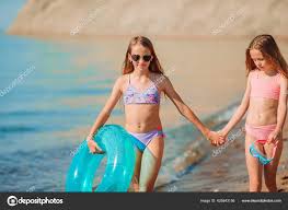 Adorable little kids on the beach during summer vacation — Stock Photo ©  d.travnikov 425843156