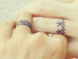 Tribal married couple matching tattoos look very original and unusual. 150 Amazing Wedding Ring Tattoo Design Ideas August2021