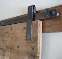 Sliding door hardware for pocket and wall mounted doors