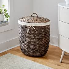 Extra large laundry hamper in blue with white pattern. Curved Lidded Laundry Hamper Basket