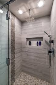 Round Tiles Give A Pebbled Look And Feel To This Stylish Walk In Shower With A Luxurious Waterfall Bathroom Shower Design Modern Shower Bathroom Remodel Shower