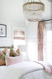 A dramatic black and pink bedroom with bright pink walls, a chair, a pink bed, a black chandelier, bedding and frames. White Bedroom With Pink Accents Colorful Bedroom Design Pink Bedroom Design Home Decor