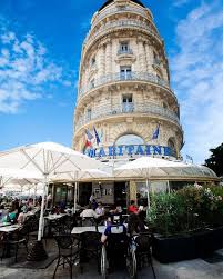Its elegantly sweeping curved glass facade and terrace look out on to the intersection of three major roads. La Samaritaine Marseille Great Spot To People Watch In The Old Port Choosemarseille Marseille Samaritaine Marseilles Old Port South Of France