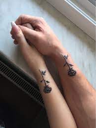 A flower tattoo is a common tattoo design which many girls and nowadays guys also like to have them. Couplegoals Coupletattoos Rosetattoo Rose Matchingtattoos Love Matching Couple Tattoos Rose Tattoos Tattoos