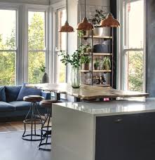 The design team from axis mundi used glass panels for a touch of dramatic shine but lined them with gold silk drapes to provide privacy to the sleeping area. 6 Tips On How To Decorate A Loft Apartment Vaunt Design