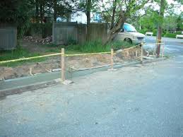 Concrete forms and accessories used to pour a curb and gutter combination. Forming A Concrete Curb Fine Homebuilding