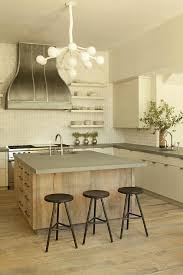 The island cabinets aren't actually attached, so we could move them out of the way when we installed the countertop along the walls. Reclaimed Wood Kitchen Island With Concrete Countertop Transitional Kitchen