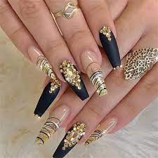 Cute black coffin nails with gold glitter on accent nail design. 26 Elegant Black Nails Ideas Aray Blog For Chic Women Black Gold Nails Coffin Nails Designs Gorgeous Nails