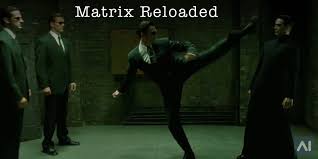 A character jumps through a window breaking it, falls toward the ground below, and shoots up at someone following; The Matrix Reloaded Artificial Intelligence Entertainment Ai Entertainment