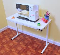Outline the sewing machine shape on the table surface. Choosing The Best Sewing Cabinet For Your Space The Seasoned Homemaker