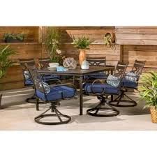 Patio dining tables are the perfect places to gather on a warm summer night. Hanover Montclair 7 Piece Steel Outdoor Dining Set With Navy Blue Cushions Swivel Rockers And Dining Table Mclrdn7pcsqsw6 Nvy The Home Depot Outdoor Dining Set Patio Dining Set Patio Dining Furniture