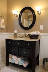 This tiny bathroom is made to feel much larger by the inclusion of mirror all around the room. Like The Higher Cabinet For My Small Guest Bathroom More Storage Space Too Like The Dark Cabinet Contr Tan Bathroom Ideas Tan Bathroom Tan And White Bathroom