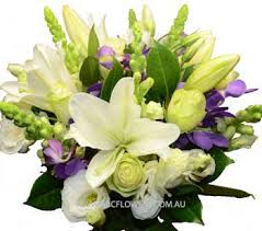 Fresh flowers hand delivered from your local florist. Abc Flowers Fitzroy Melbourne A037 Heidelberg A Centre Piece Arrangement With White Roses White Lilies Other White Flowers And Blue Flowers Delivery Melbourne Wide