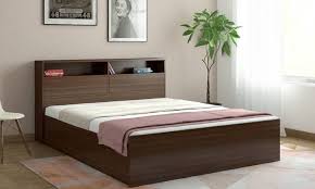 Engineered Wood Queen Bed With Storage Featuring Convenient Storage Compartment This Simple Design Be Bed Design Modern Wooden Bed Design Simple Bed Designs