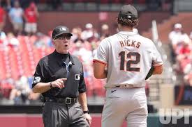 Photo: Umpire Lance Barksdale talks with San Francisco Giants starting  Pitcher Jordan Hicks