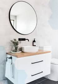 White Bathroom With Circular Mirror And Plywood Vanity Round Basin Accented Wit Circular Mirror White Bathroom Bathroom Inspiration