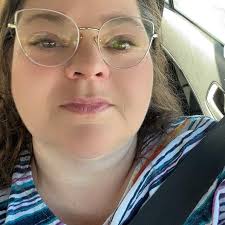 What type of bird is this baby with blue eyes and a unique beak?