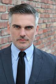 Stern Looking Guardian Hummingbird Near the Lantana Flowers Stock Photo