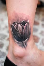 25 Tulip Tattoo Images Pictures And Designs Tulip Tattoo Flower Tattoo On Ankle Tattoo Designs