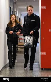 Kaufbeuren, Germany. 04th Dec, 2018. The accused actress Antje Mönning (l)  and her lawyer Alexander Stevens are brought to trial for arousing public  anger in a courtroom of the district court. The