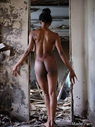 Porn image of from behind photo african nude black hair looking at viewer  abandoned building created by AI