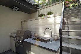 white brick outdoor kitchen with