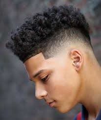 The haircut features a neatly combed top framed by a crisp outline. 35 Popular Haircuts For Black Boys 2021 Trends