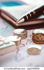 Closeup Coins With Line Chart Pen And Calculator
