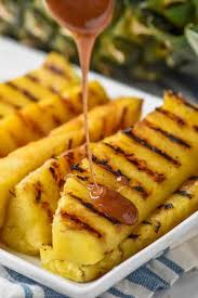 Toss pineapple spears in melted butter and then brown sugar, coating each one as evenly as possible. Grilled Pineapple Simple Joy