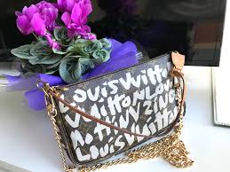 Certain pieces, which featured the graffiti without the monogram canvas background, were only available on louis vuitton's v.i.p. Louis Vuitton Graffiti Monogram Pochette Handbag W Chain