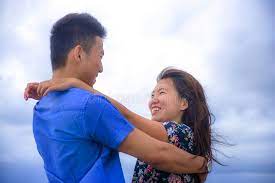 Young asian couple have romantic time while asian couple using a tablet for online shopping. 81 724 Hug Romance Photos Free Royalty Free Stock Photos From Dreamstime