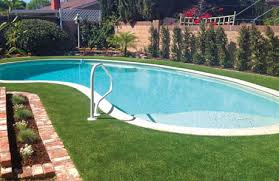 Synthetic turf is a way you can enjoy lush, green lawn all year round. Swimming Pool Decks Using Grass Lawns In Photos