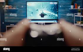 Close up of gaming TV in modern living room at home. POV of video games on