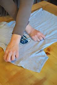 How To Fold A T Shirt Like A Pro T Shirt Folding Shirt Folding Folding Clothes