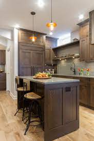 Craftsman Kitchen With Tree Stump Butcher Block Two Islands Lauren Levant Hgtv Brown Kitchen Cabinets Dark Wood Kitchen Cabinets Home Kitchens