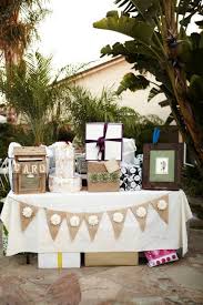 Gift Table With Banner Pom Poms Hanging Above And Chalk Board That Says O You Shouldn T Have Gift Table Wedding Rustic Wedding Shower Gifts Gift Table